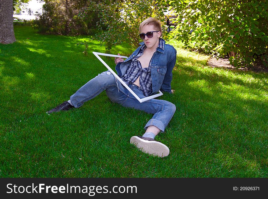 Young human on the green grass in white frame