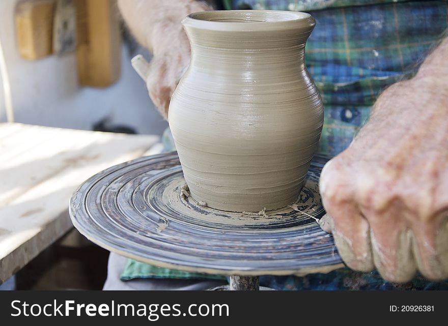 The creation of pottery on wheel