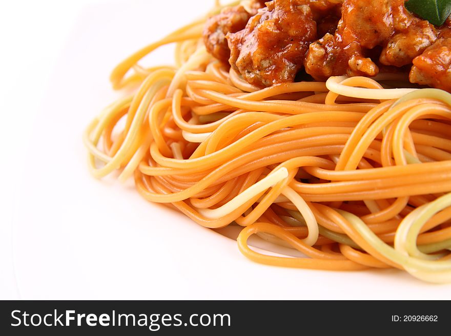 Colorful Spaghetti bolognese on a plate in close up