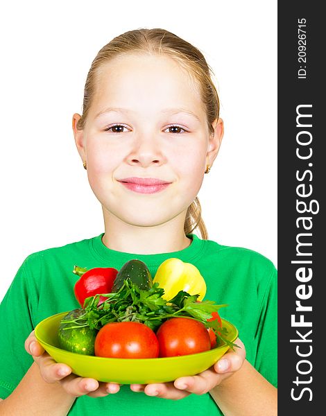 Little girl with vegetables isolated on white