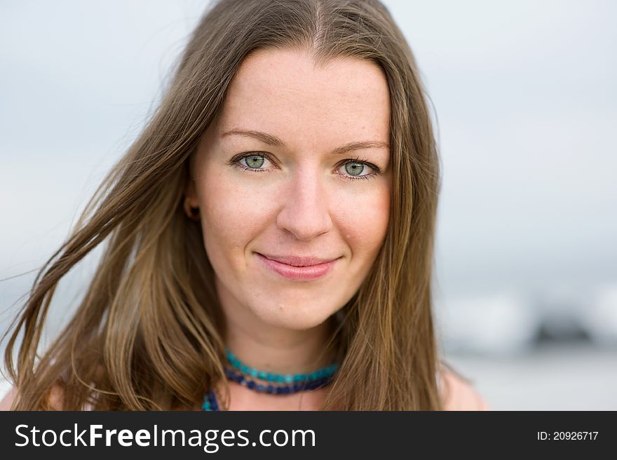 Portrait of a beautiful brunette woman with a necklace. Portrait of a beautiful brunette woman with a necklace