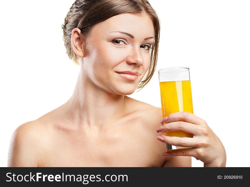 Young beautiful woman drinking orange juice isolated on a white background