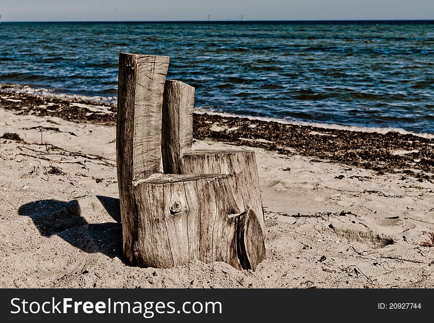 Two homemade chairs placed on beach. Two homemade chairs placed on beach