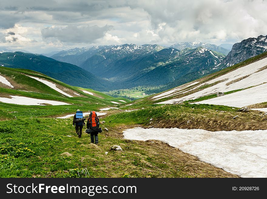 Snow and grass in the North Caucasus mountains. Russia.