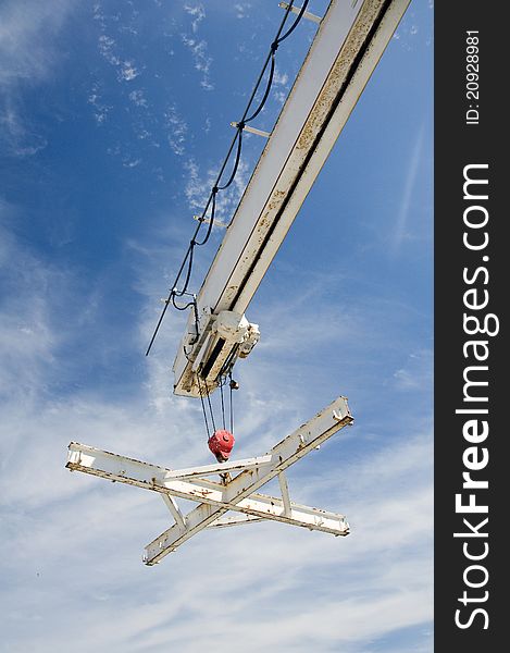 Boat lifter crane in a spanish marina. Boat lifter crane in a spanish marina