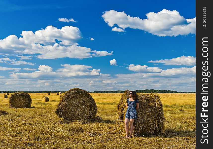 Stacks of collected wheat. The big yellow field after harvesting