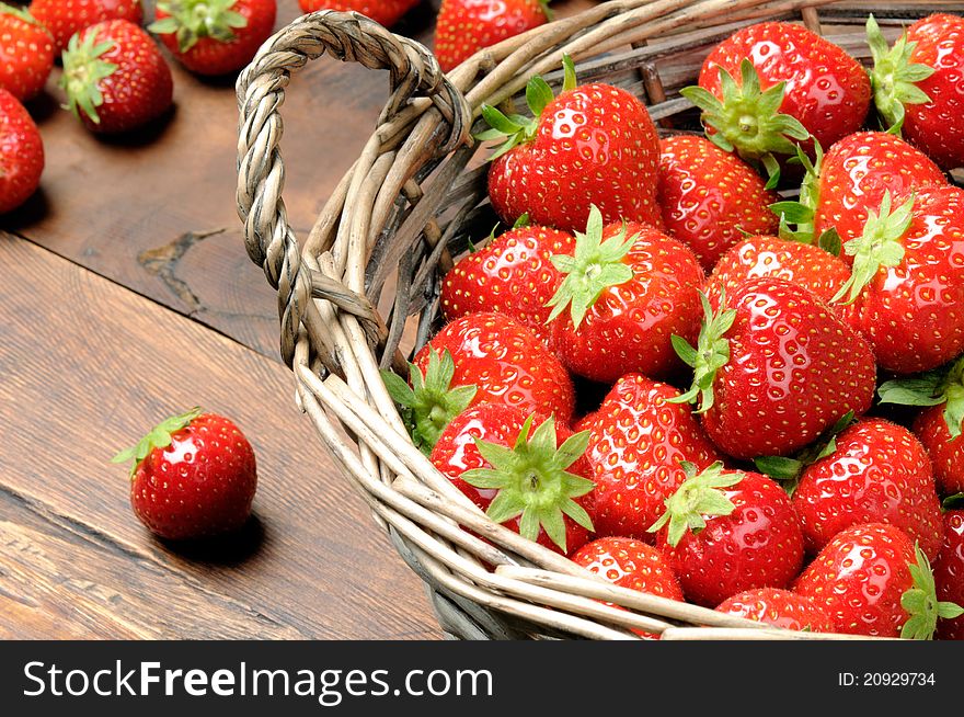 Fresh strawberries in the  wicker basket