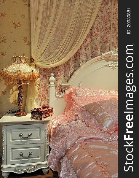 Flowery and pink color bedding and furniture in bedroom, elegance and fine style for female. Flowery and pink color bedding and furniture in bedroom, elegance and fine style for female.