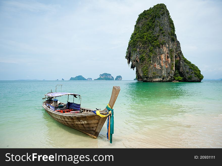 A longtail boat in the water near Railay, Thailand. A longtail boat in the water near Railay, Thailand