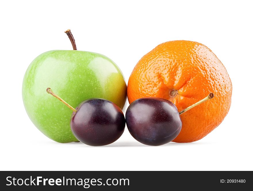 Apple, orange and two plums on white background