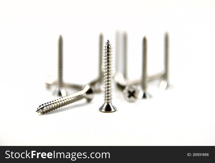 Screw and bolt head shot on white background.