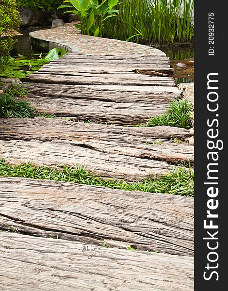 Walkway cross the pond in the garden