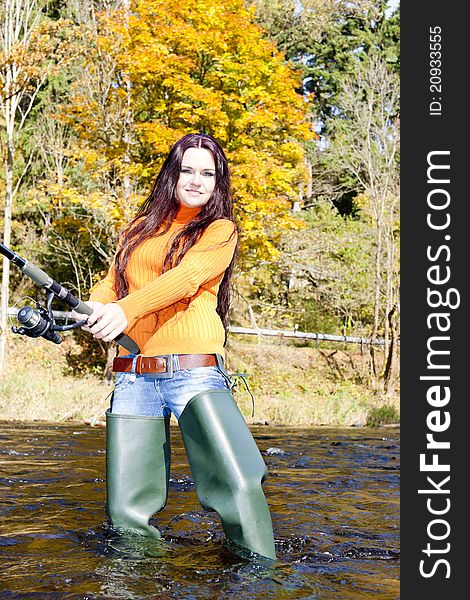 Woman fishing in Otava river, Czech Republic. Woman fishing in Otava river, Czech Republic