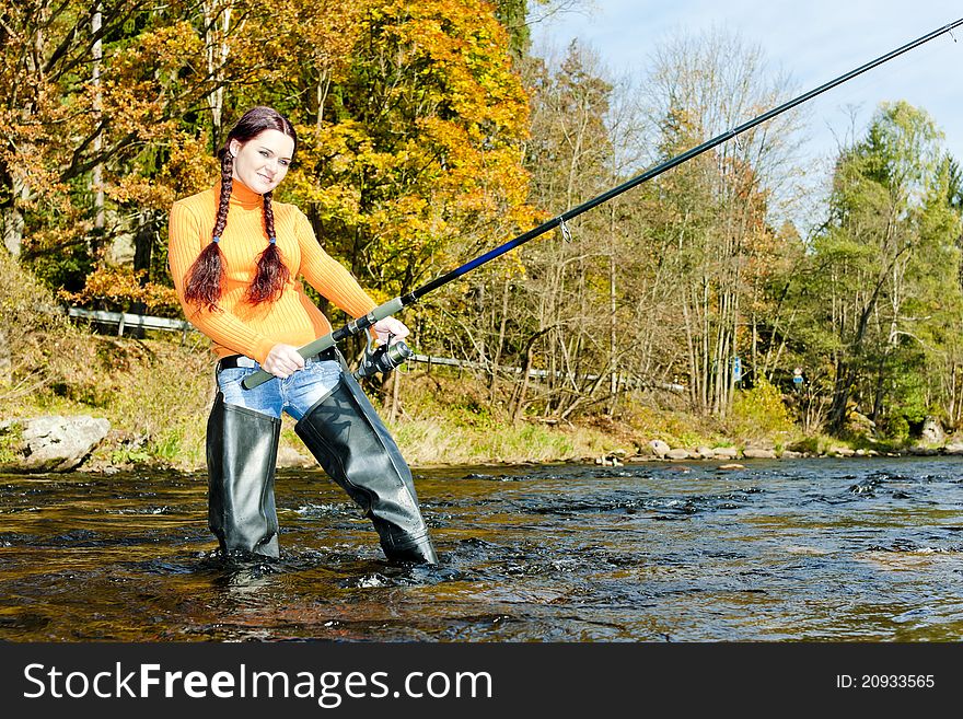 Woman fishing in Otava river, Czech Republic. Woman fishing in Otava river, Czech Republic