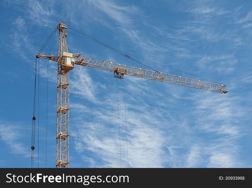 Ð¡onstruction crane on blue sky background. Ð¡onstruction crane on blue sky background