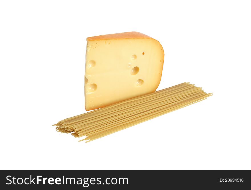 Big piece of cheese near raw spaghetti on white background. Isolated with clipping path. Big piece of cheese near raw spaghetti on white background. Isolated with clipping path