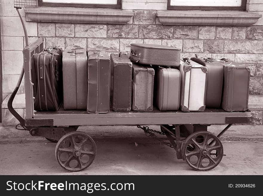 Old Suitcases on Transport Trolly at Railway Station