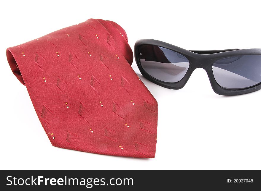 Fashion for men red necktie and sun glasses isolated on white background. Fashion for men red necktie and sun glasses isolated on white background