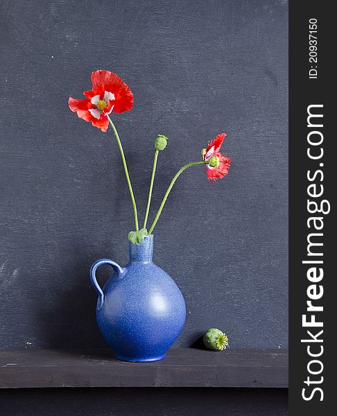 Blue Vase And Poppy Blossoms