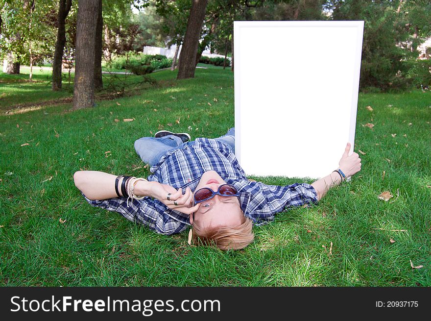 Young human on the green grass with white frame