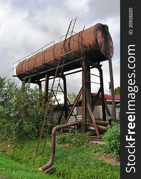 Old rusty water tank in garden