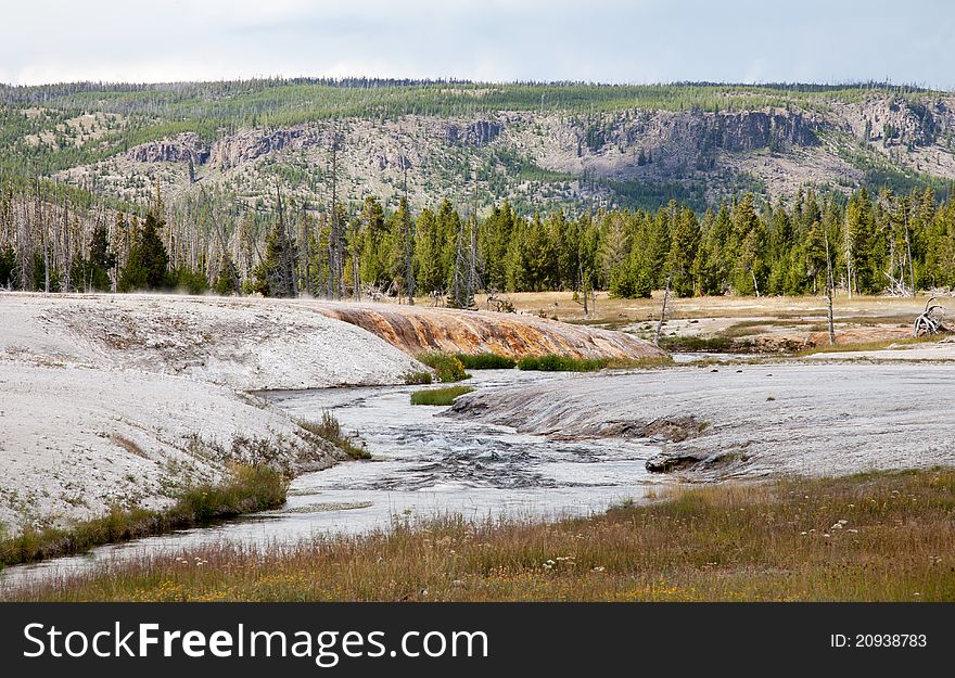 This is a landscape scene from the Black Sand Basin in Yellowstone National Park, Wyoming