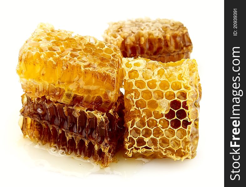 Honey honeycombs on a white background