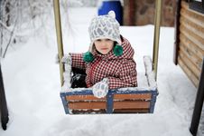 Adorable Child Girl Enjoys Seesaw In Winter Stock Photo Adorable Child Girl Enjoys Seesaw In Winter Stock Photo