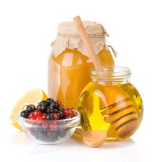 Glass Jar Full Of Honey And Berry Stock Photography Glass Jar Full Of Honey And Berry Stock Photography