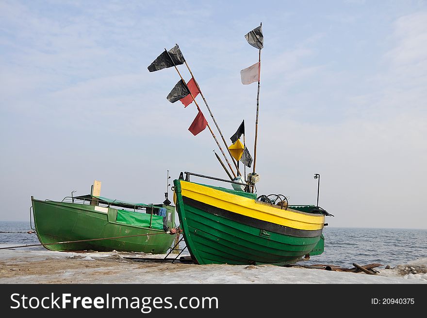Old green fishing boats on the beach in Gdynia OrÅ‚owo. Old green fishing boats on the beach in Gdynia OrÅ‚owo