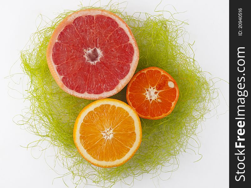 Three citrus green straw on a white background