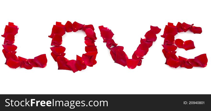 The word love of rose petals on white background