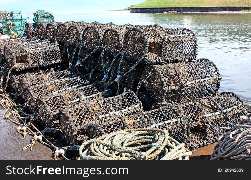 A Stack of Lobster and Crab Pots on a Harbour Wall. A Stack of Lobster and Crab Pots on a Harbour Wall.