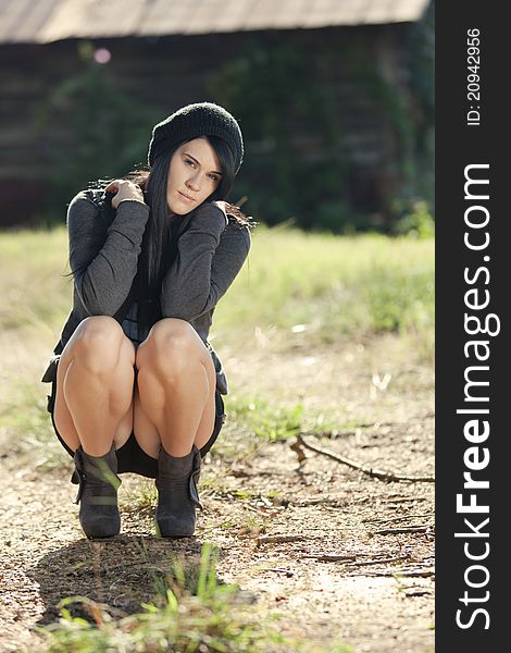 Beautiful Young Woman Crouching