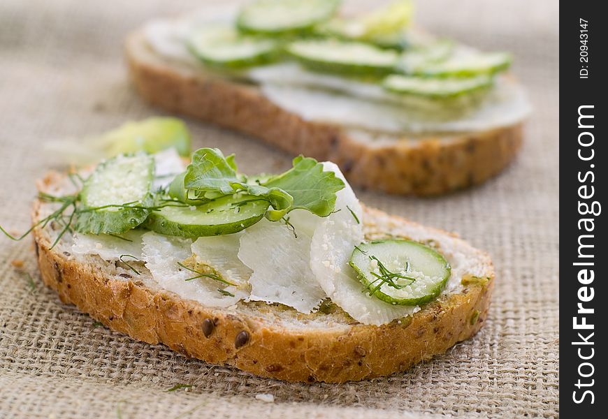 Wholegrain healthy sandwich with cucumber and cabbage. Selective focus