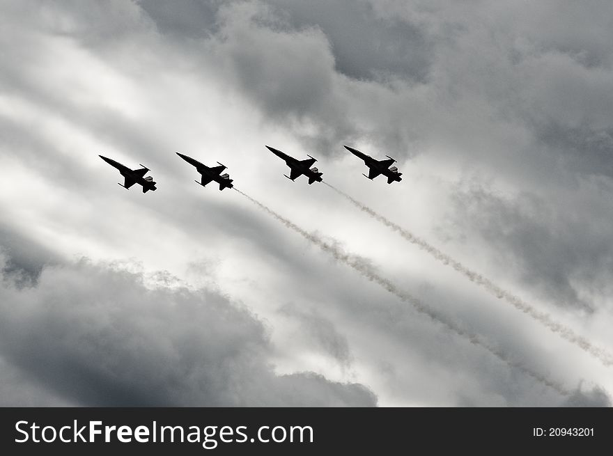 F-5 fighters flying in cloudy conditions. F-5 fighters flying in cloudy conditions