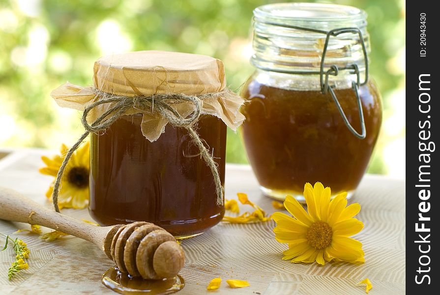 Flower honey in glass jar. Selective focus