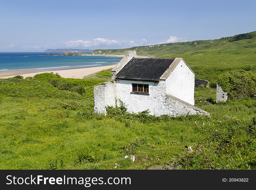 A small seaside cottage on a beautiful, sunny day. A small seaside cottage on a beautiful, sunny day