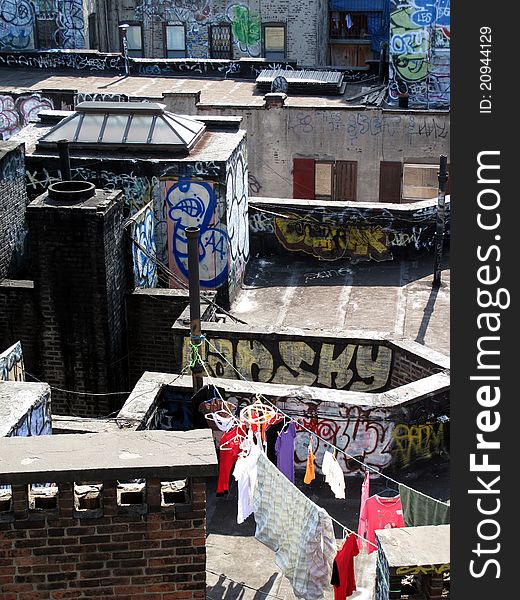 laundry drying on clothesline on graffiti filled NY rooftop. laundry drying on clothesline on graffiti filled NY rooftop