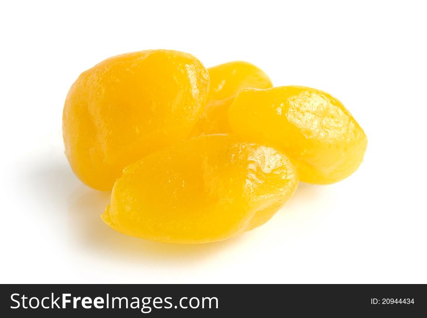 Dried lemons in sugar syrup close-up Isolated over white background