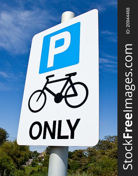 A sign indicating that only cycles may park. A sign indicating that only cycles may park