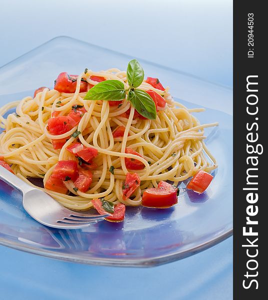 Photo of delicious spaghetti with garlic and oil sauce on wooden table