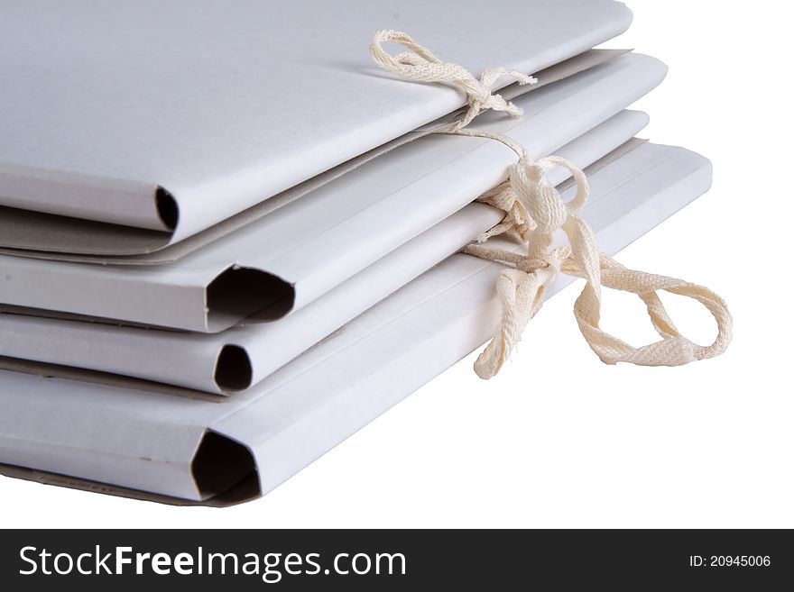 Bunch of white cardboard folder with ties. Bunch of white cardboard folder with ties