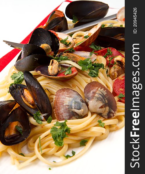 Photo of delicious pasta with clams and mussel