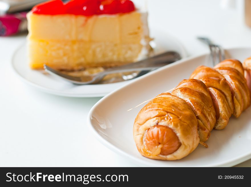 Strawberry Cheesecake and croissant in the coffee shop. Strawberry Cheesecake and croissant in the coffee shop