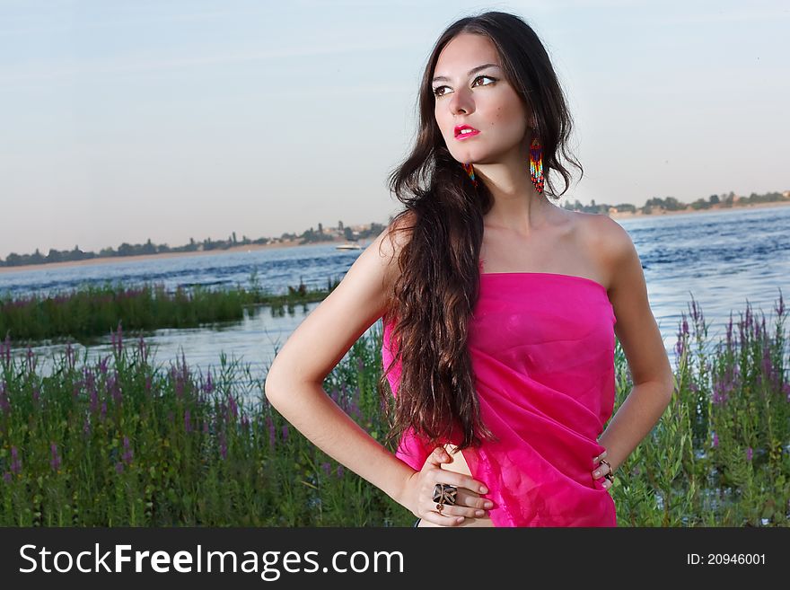 Face of woman in the red dress with beautiful eyes. Face of woman in the red dress with beautiful eyes.