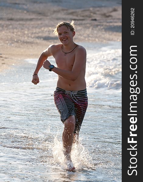 Teenager running on the water. Teenager running on the water