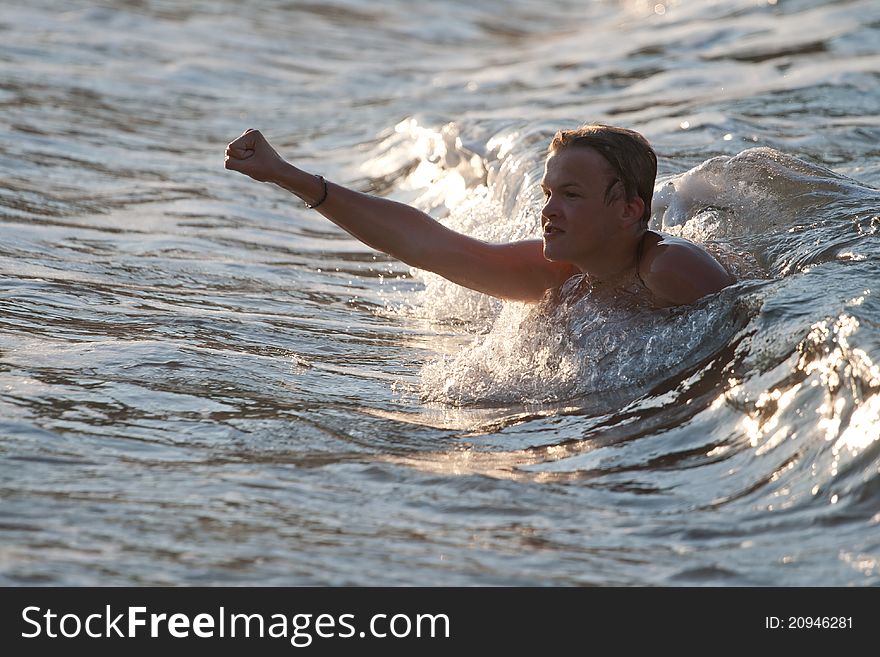 Boy Pushed By The Wave