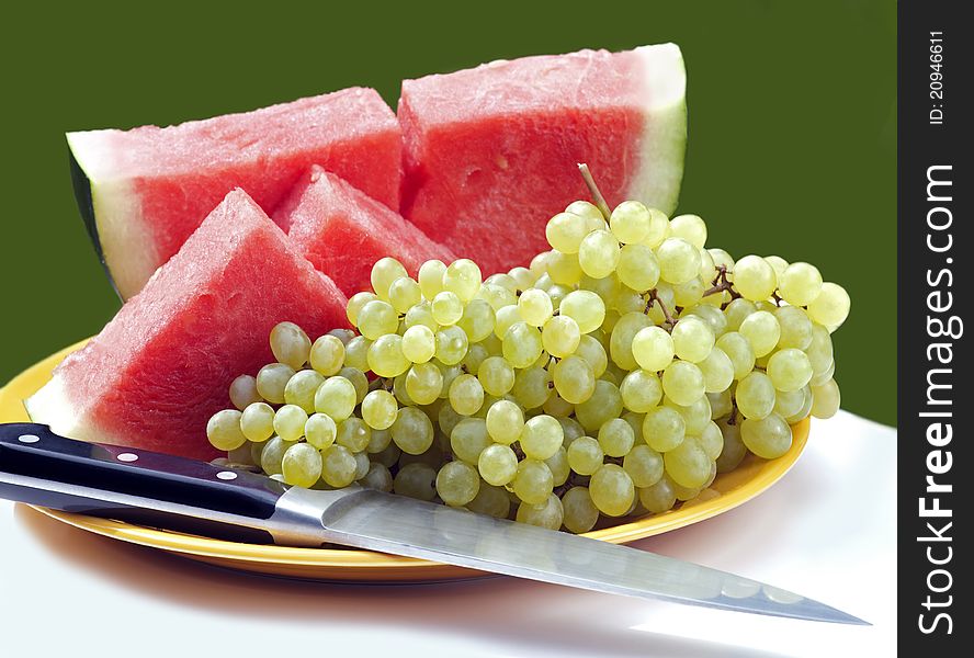 Sweet grape of Champagne vine and red melon. Sweet grape of Champagne vine and red melon