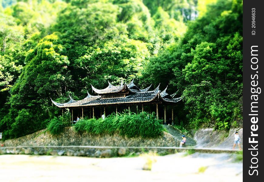 It is a beautiful Chinese pavilion in Bai Shui Yang(a tourist attraction in Fujian, CHina).It is made of wood and Its rooftop is made by tile.